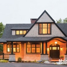 Evening view of shingle-style home