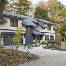 The homeowners of this Cape Elizabeth cottage were looking for something inspired by the American Craftsman style of the 20th century, hence the flared detailing on the columns and second-story roof. The white-dipped cedar shingles contrast with the soft black trim—another nod to Maine’s earlier design eras.