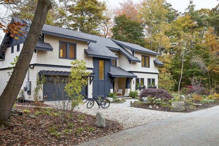 The homeowners of this Cape Elizabeth cottage were looking for something inspired by the American Craftsman style of the 20th century, hence the flared detailing on the columns and second-story roof. The white-dipped cedar shingles contrast with the soft black trim—another nod to Maine’s earlier design eras.