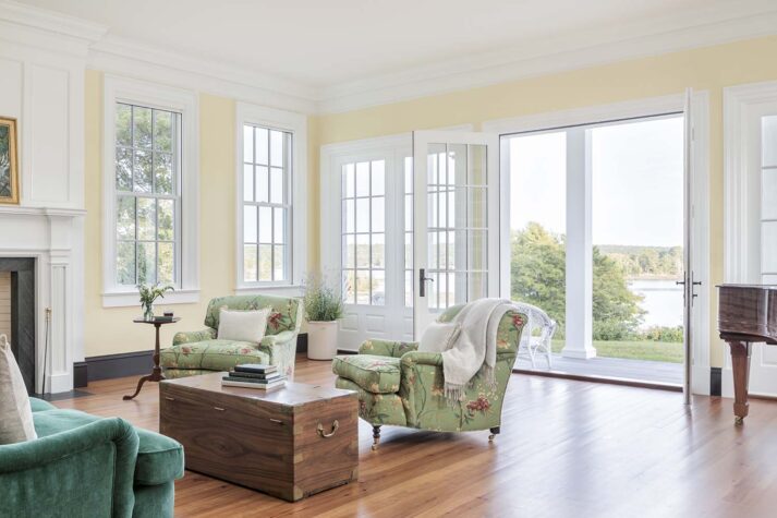 The family room with large windows that look out to the water