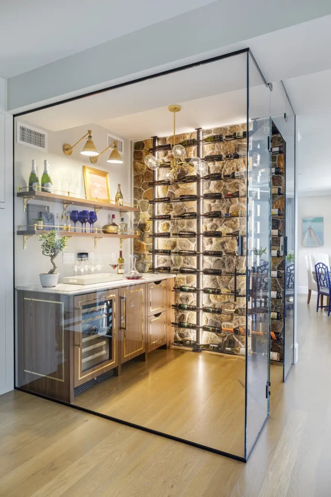 The wine cellar incorporates the husband’s love of stone (he had been a stone mason) but modernizes it with a glass enclosure.